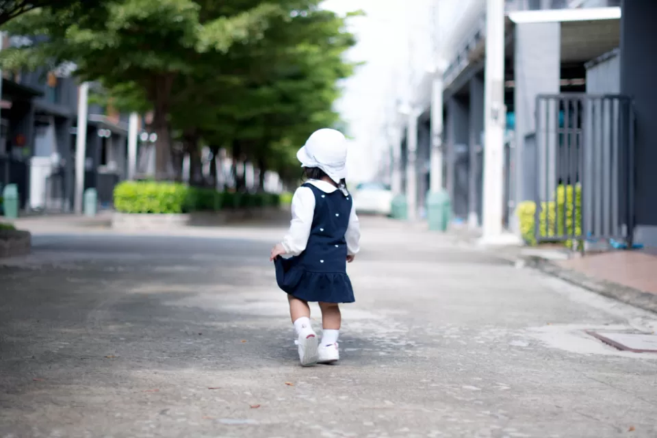 Toddler walking on street